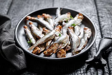 Foto op Aluminium Healthy and fresh smoked sprats as popular mediterranean food. © shaiith