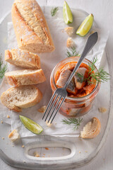 Delicious and fresh pickled herring served with dill and bread. - 766312687