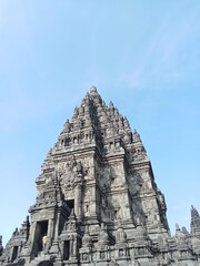 Prambanan temple with bright blue clouds