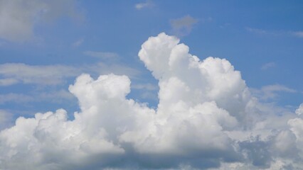 Ornamental clouds. Dramatic sky. Epic cloudscape. Soft sunlight. Panoramic image, texture, background, graphic resources, design, copy space. Meteorology, heaven, hope, peace concept