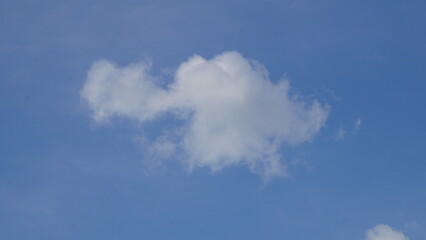 Ornamental clouds. Dramatic sky. Epic cloudscape. Soft sunlight. Panoramic image, texture, background, graphic resources, design, copy space. Meteorology, heaven, hope, peace concept