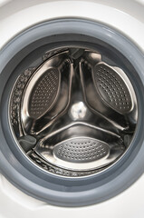 Inside view of empty washing machine close up
