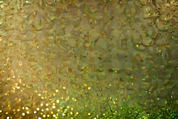 Green background with golden light effects. Horizontal background with bokeh blur effects for Christmas
