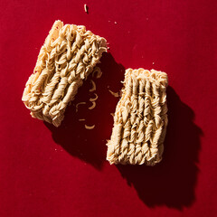 Chinese instant egg noodles on red background. Retro style 80-90s food photography