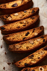 Rows of Almond and Cranberry Biscotti Cooling on Parchment, Intimate Kitchen Atmosphere