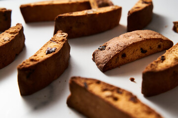 Close-Up of Assorted Almond, Hazelnut, and Cranberry Biscotti Arrayed on Pristine White Background