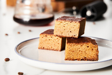 Sweet Breakfast concept. Blondies bars with v60 filter coffee, light background, airy mood food photo