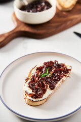 Delicious French Appetizer Freshly Cooked Onion Confit or confiture. Also known as Onion Marmalade or Jam or Chutney. Homemade from sweet onions with Porto wine and spices. Top view.