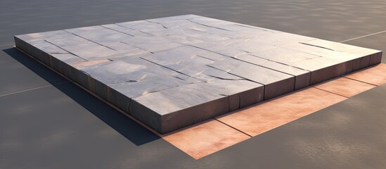 The image depicts a detailed view of a sturdy rectangular stone block resting on a flat surface, showcasing its texture and shape