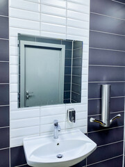 Bathroom with sink, mirror on wall, plumbing fixtures in property