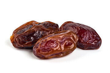 Raw Organic Medjool Dates, isolated on white background.