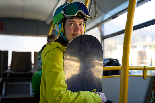 Snowboarder Smiling on Resort Shuttle Bus