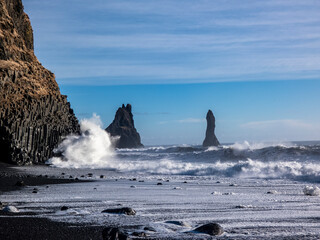 Waves crashing against basaltic rocks on Reynisfjara beach
