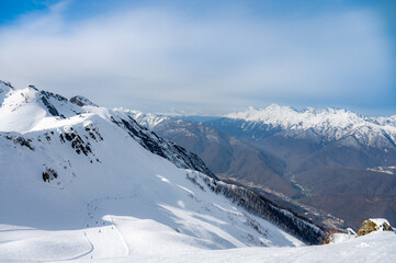 Fototapeta na wymiar peaks of snow-capped mountains in winter