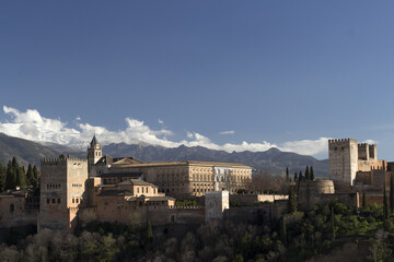 Fototapeta premium Alhambra and Sierra Nevada Mountains in background, Granada, Spain