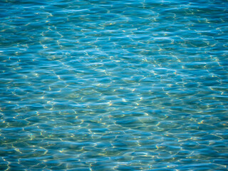 Water surface in the bay of Ogliastro Marina in Italy.