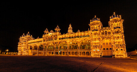 Spectacular Light illumination of Royal Mysore Palace is illuminated with 97000 electric bulbs on Sundays, national holidays & during ten days of Dasara Celebrations. Mysore, Karnataka, India.