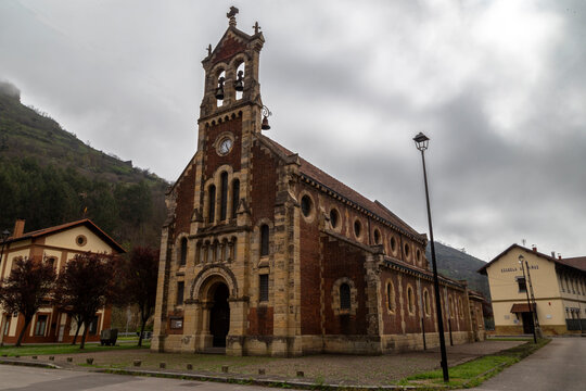 Church of San Claudio de Bustiello from the 19th century on a cloudy day. Asturias, Spain.