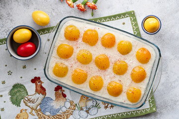 Homemade German Fried Egg Cake Spiegeleierkuchen (Spiegeleiertorte) with apricot and coconut milk pudding. Traditional Easter Dessert. Festive Easter food.