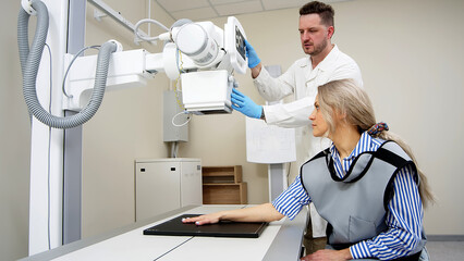 A specialist radiologist doctor installs an x-ray scanner for a patient. Medical research, injury...