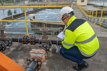 Engineer checking the water supply valve,Plumbing maintenance technicians open and close the main water supply.