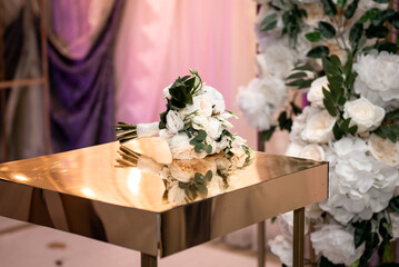 Bouquet of flowers on a golden table