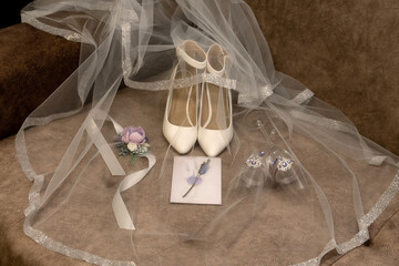 Still life with a bride's shoes, glasses and veil	