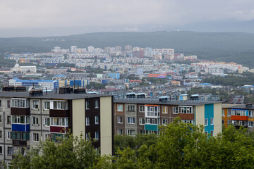 Evening urban landscape. Top view of residential urban areas. Old panel buildings in a provincial town. Overcast weather. City of Petropavlovsk-Kamchatsky, Kamchatka Territory, Far East of Russia.
