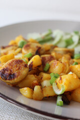 Delicious German Sausage and Potato Skillet with Refreshing Cucumber Salad