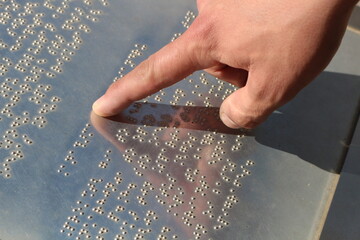 Touch of Understanding: Hands Reading Braille Language