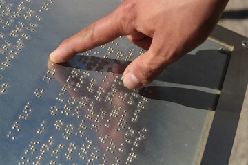 Touch of Understanding: Hands Reading Braille Language