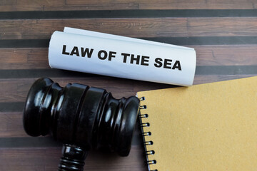 Law of the Sea text on Document and Gavel isolated on office desk. Justice law concept