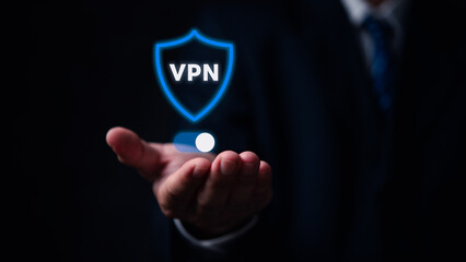 A man is holding a pill in his hand and the word VPN is displayed in blue