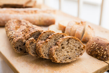 Fresh loaf of bread on wooden board