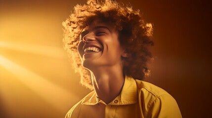 Joyful young person laughing with sunlight beaming behind in warm tones