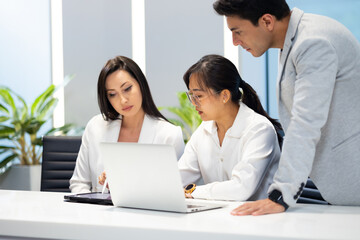 Business meeting -  Group of friends meeting at home. Diverse business people asian woman and caucasian man discussion in corporate meeting at conference room