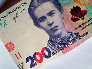 The image shows a 200 UAH bill with the central portrait area. - obrazy, fototapety, plakaty