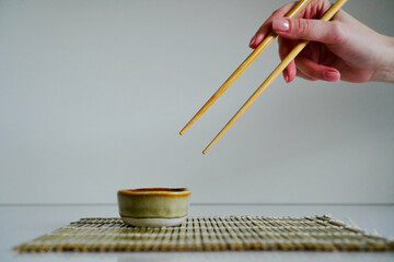 chopsticks and bowl of soy sauce