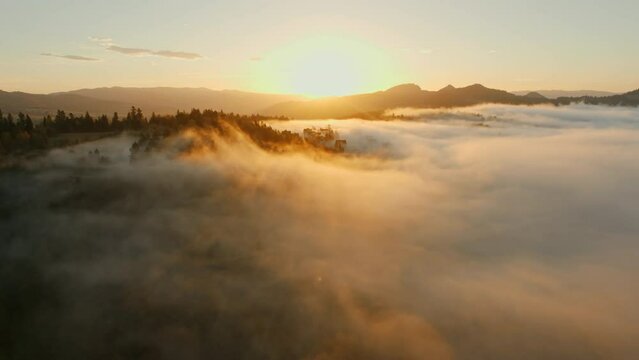 Beautiful mountain landscape at sunrise on a foggy morning