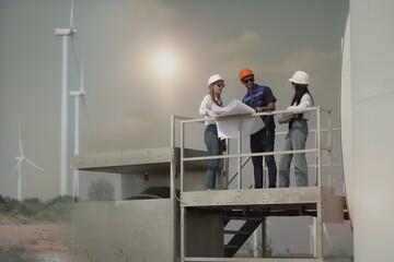 Young man and woman maintenance engineer team. two engineer operate wind turbine. Engineer and worker discussing on a wind turbine farm. Wind Turbine. Maintenance Workers. renewable energies..