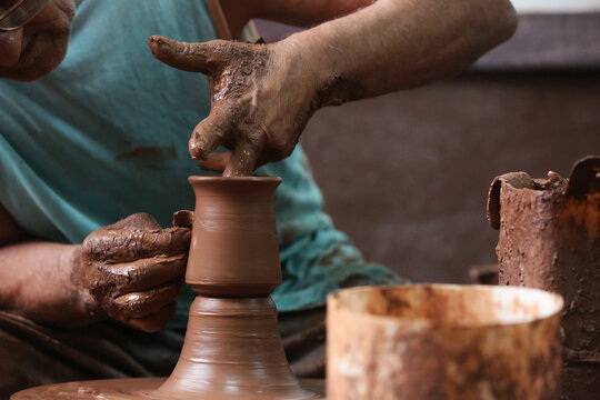 hands of a craftsman working with clay