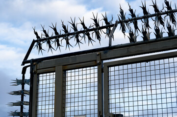 Razor wire on security fence at construction site