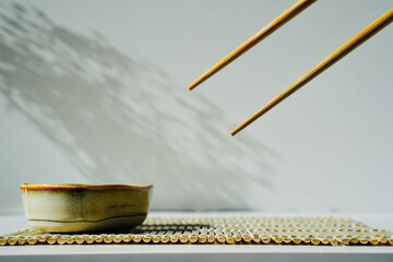 chopsticks and bowl of soy sauce