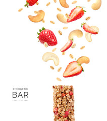 Creative layout made of strawberry protein bar with strawberry, cashew and oatmeal on white background. Flat lay. Food concept.