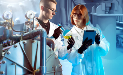 Scientific lab staff. Scientists at nuclear research center. Man and woman near scientific equipment. Teamwork scientists. Specialists stand near hadron collider. Tablet and flask in hands scientists