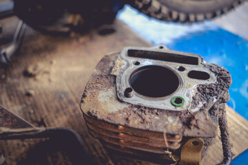 Motorcycle engine block with repairs and maintenance.