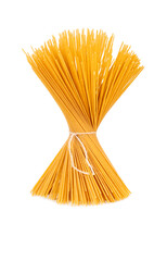 Raw spaghetti pasta tied with thread isolated on white background