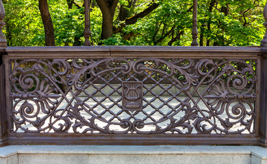Wrought iron fence in resort park.