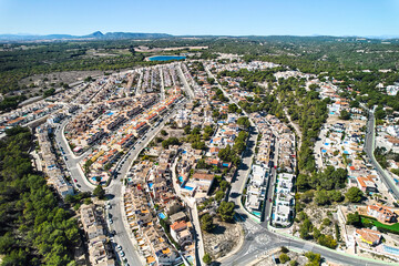 Drone point of view countryside meadows and Pinar de Campoverde residential district view with...