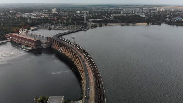 A beautiful view from above of the largest hydroelectric power plant in Ukraine - the Dnieper Hydroelectric Power Station. Dneproges before the shelling of Russian troops. Top view city of Zaporozhye.